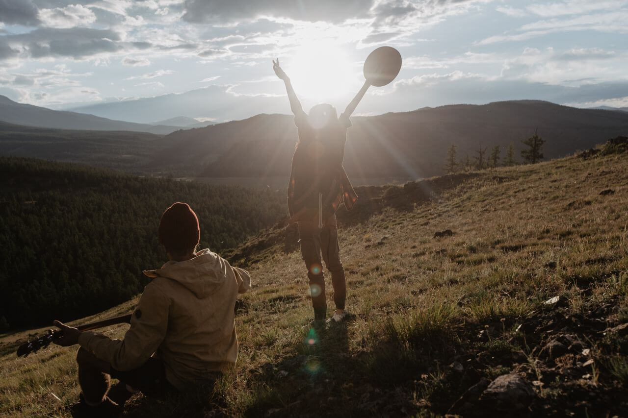 couple enjoying the scenery on a mountain